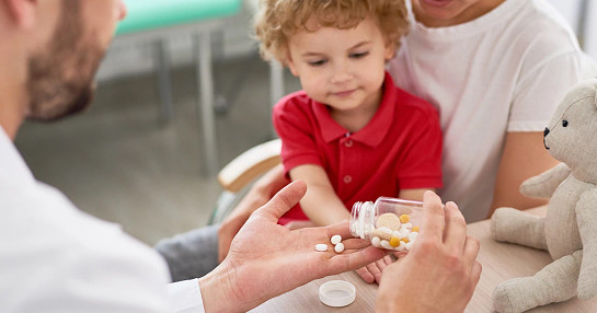 child taking medicine