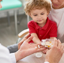child taking medicine
