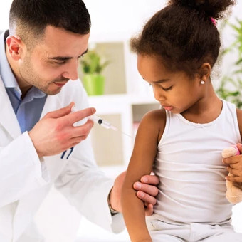 Doctor-giving-girl-injection