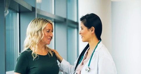 Female doctor with female patient Female doctor with female patient