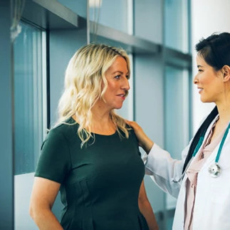 Female doctor with female patient