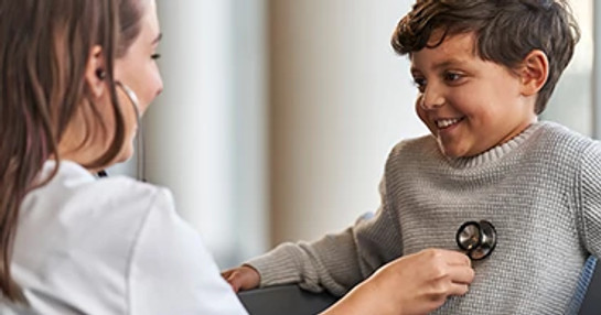 female-doctor-with-smiling-boy-patient