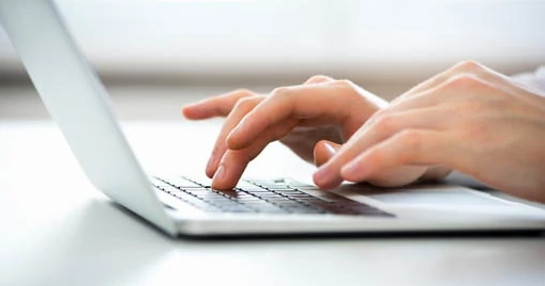 Hand-typing-on-laptop