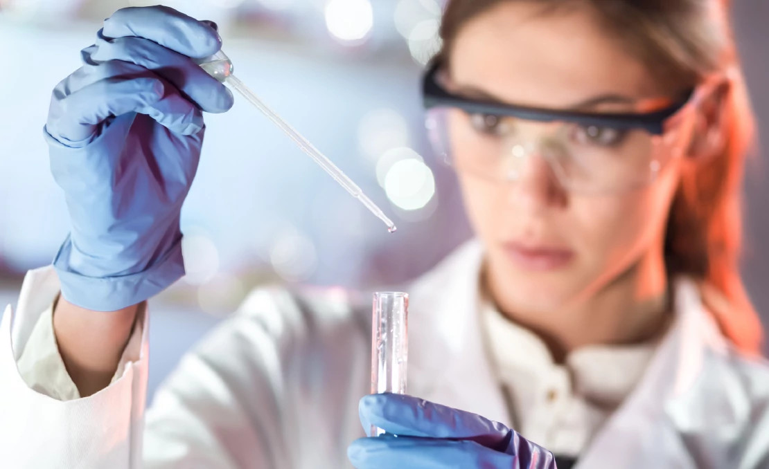 woman working with sample and test tube woman working with sample and test tube