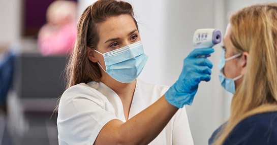 Nurse with temp gun_1 Nurse with temp gun_1
