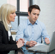 Two colleagues looking at laptop.jpg