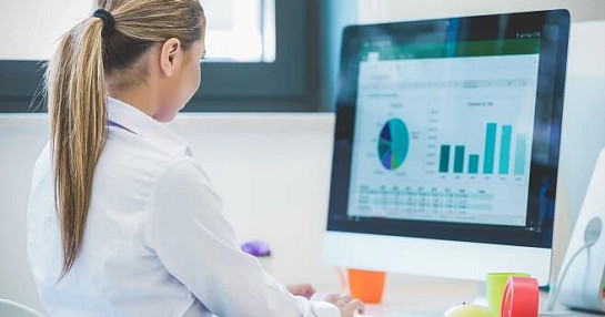 women-reviewing-data-on-screen